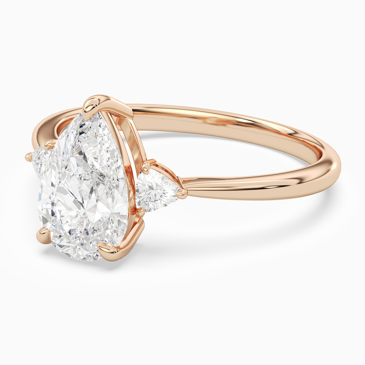 Pear Trillion Three Stone Small Sides in 14K Rose Gold top angle