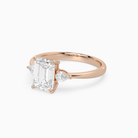 Emerald Pear Side Three Stone Classic in 14K Rose Gold top angle