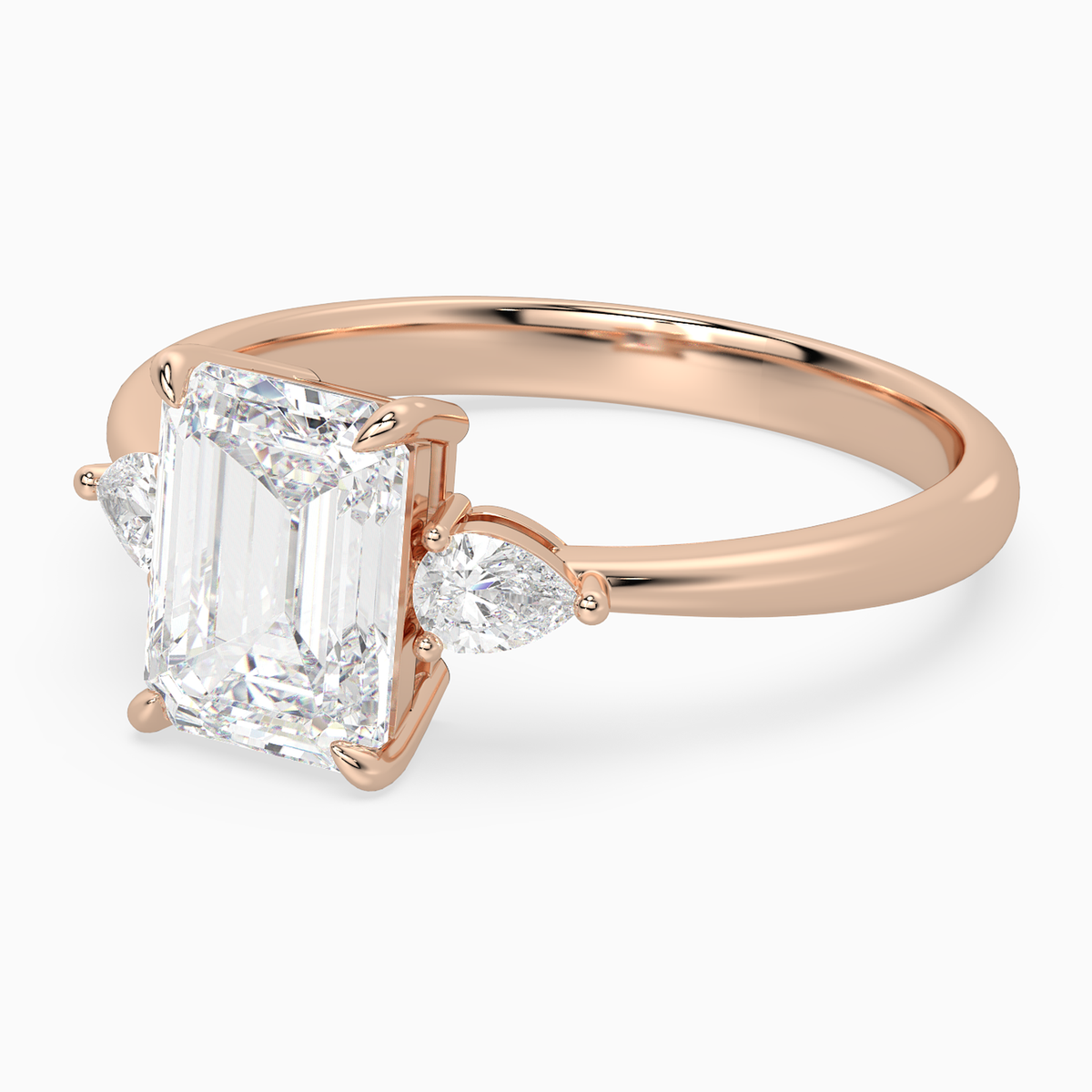 Emerald Pear Side Three Stone Classic in 14K Rose Gold top angle