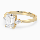 Emerald Pear Side Three Stone Classic in 14K Yellow Gold top angle