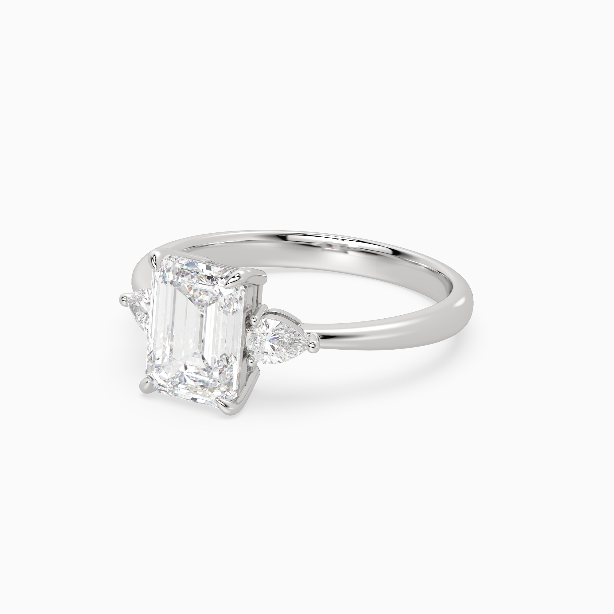 Emerald Pear Side Three Stone Classic in Platinum top angle