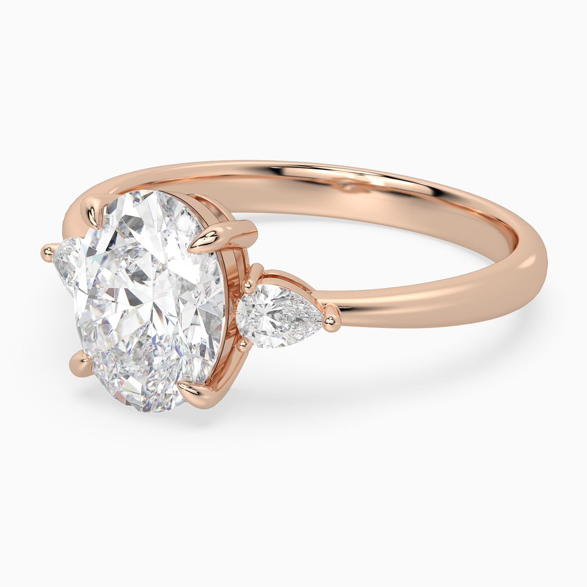 Oval Pear Side Three Stone Classic in 14K Rose Gold top angle