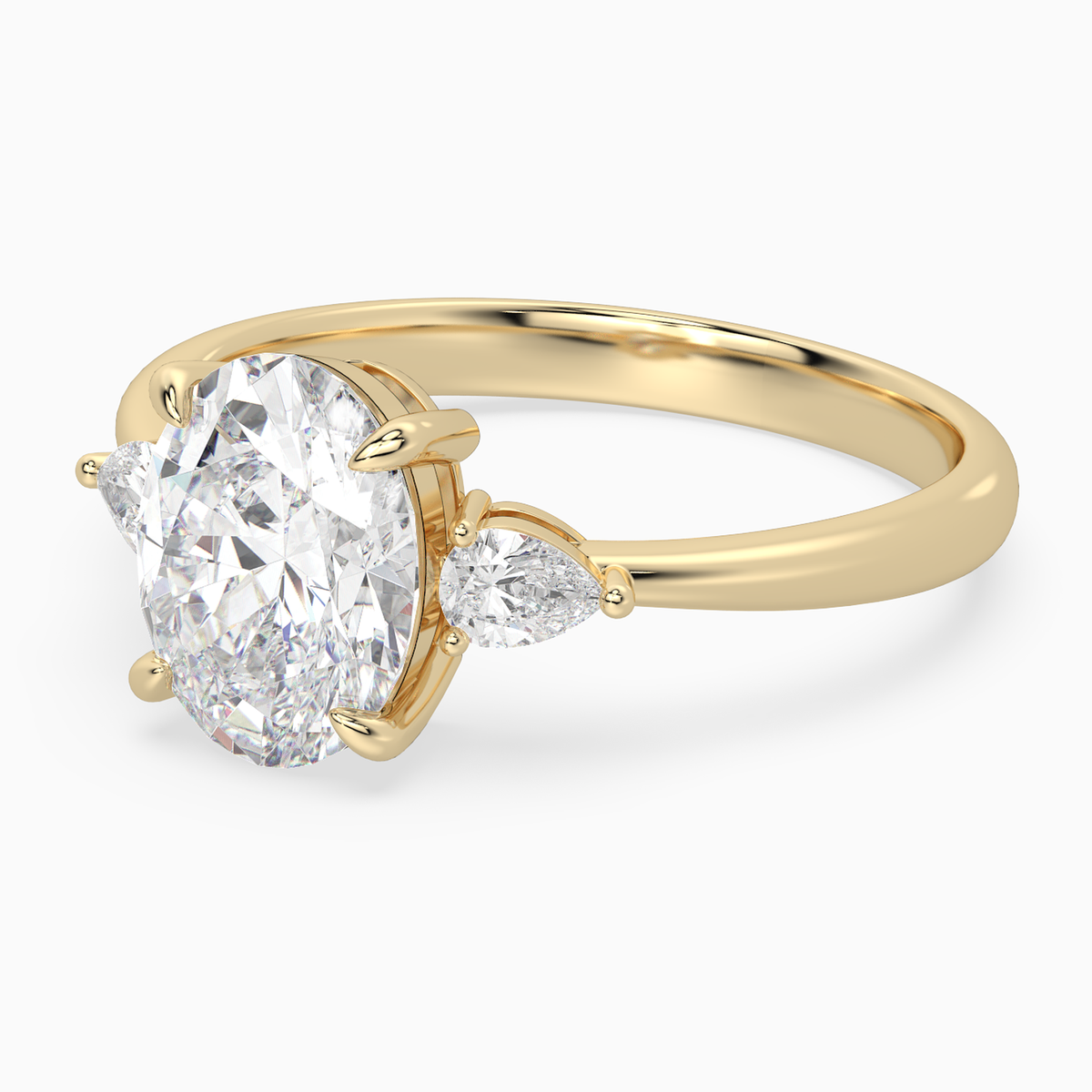 Oval Pear Side Three Stone Classic in 14K Yellow Gold top angle