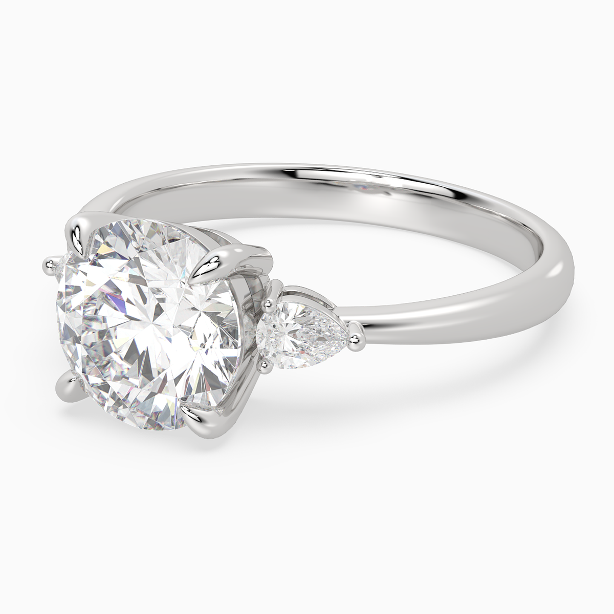 Round Pear Side Three Stone Classic in Platinum top angle