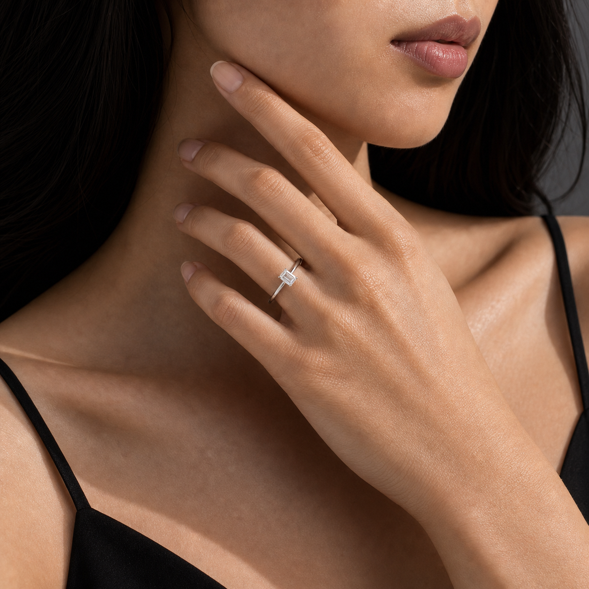 Emerald Petite Classic Solitaire in Platinum wearing