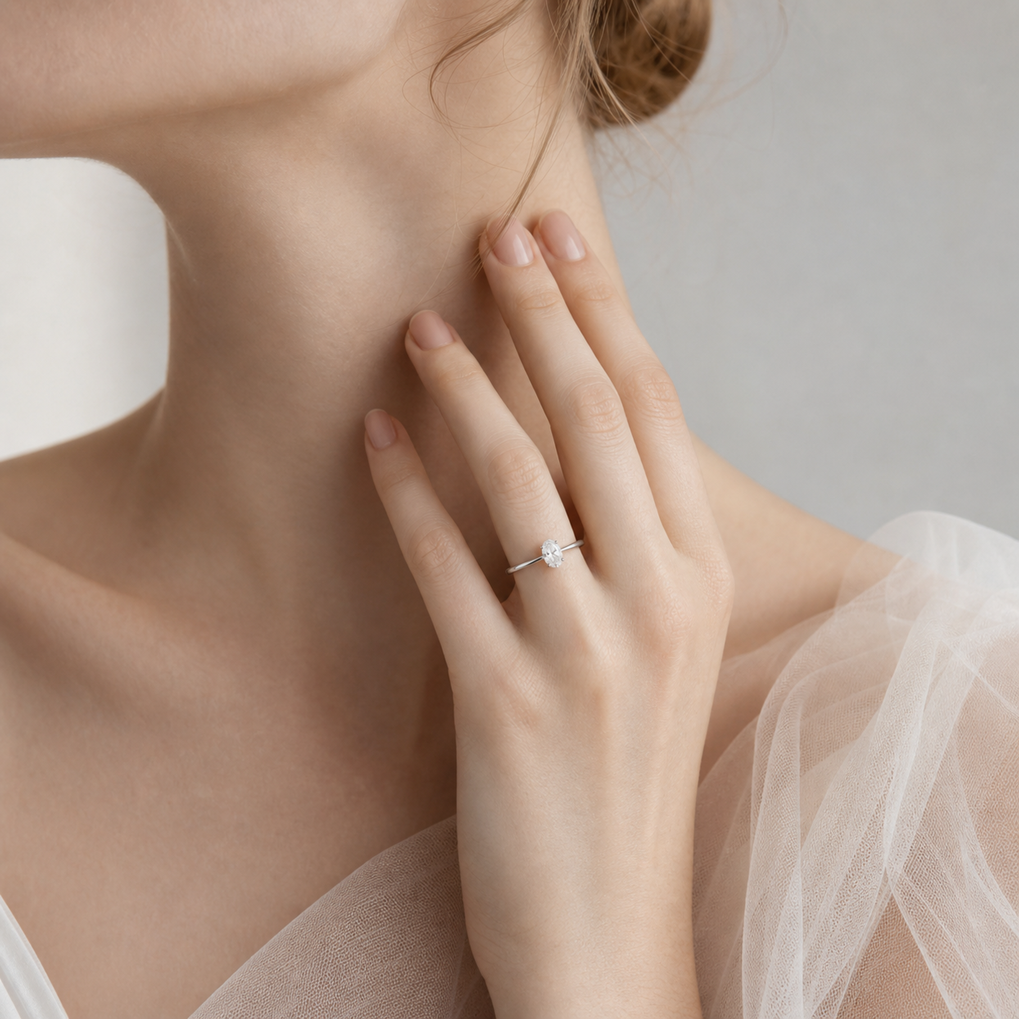 Oval Petite Classic Solitaire in 14K White Gold wearing