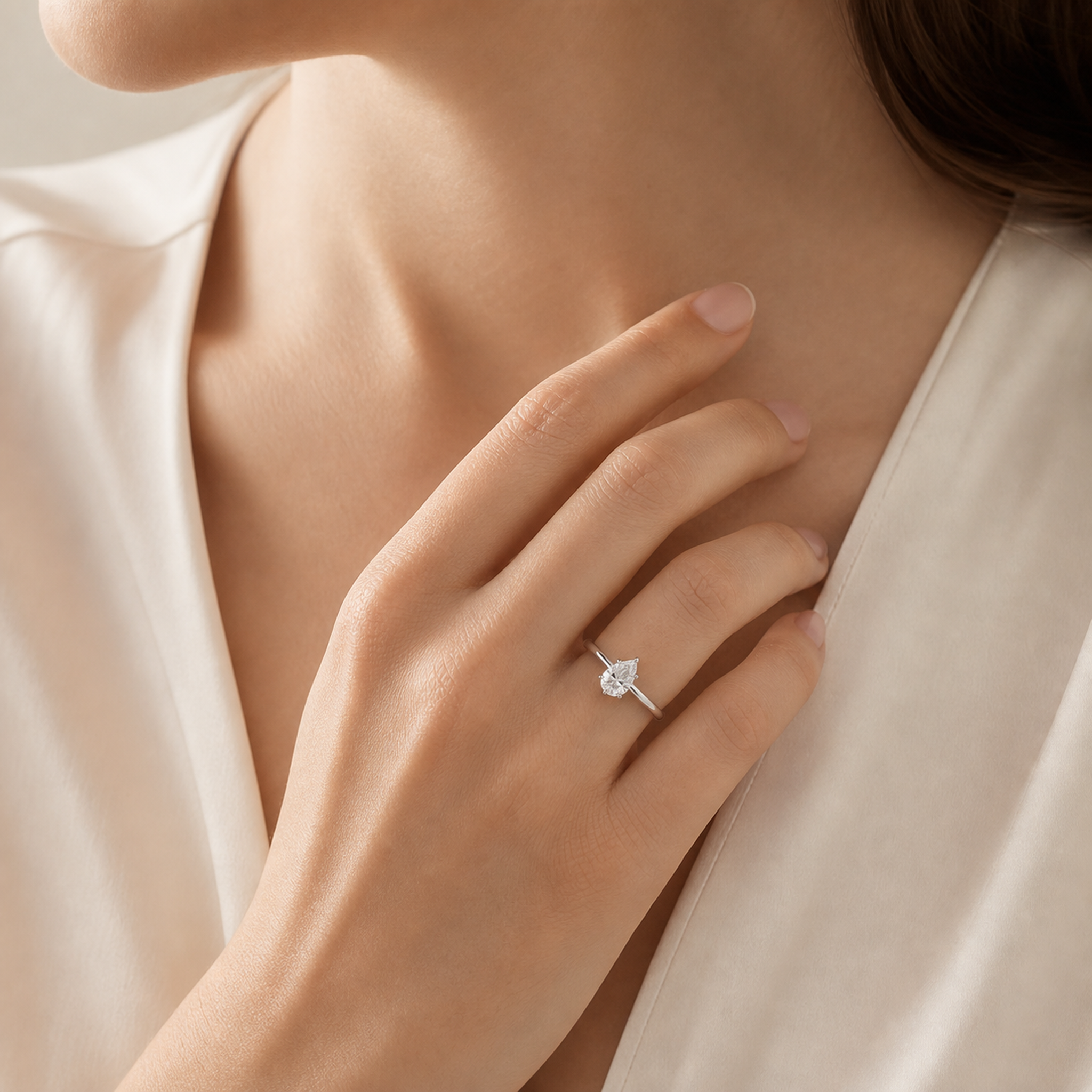 Pear Petite Classic Solitaire in Platinum wearing