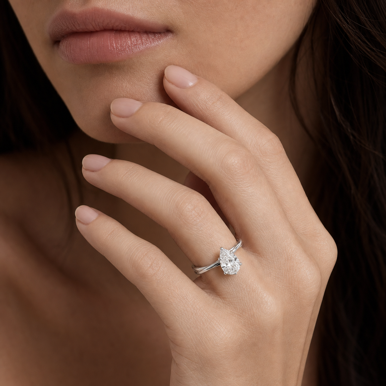 Pear Tapered Solitaire in Platinum wearing