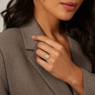 Emerald Medium Tapered Bezel Solitaire in 18K White Gold wearing