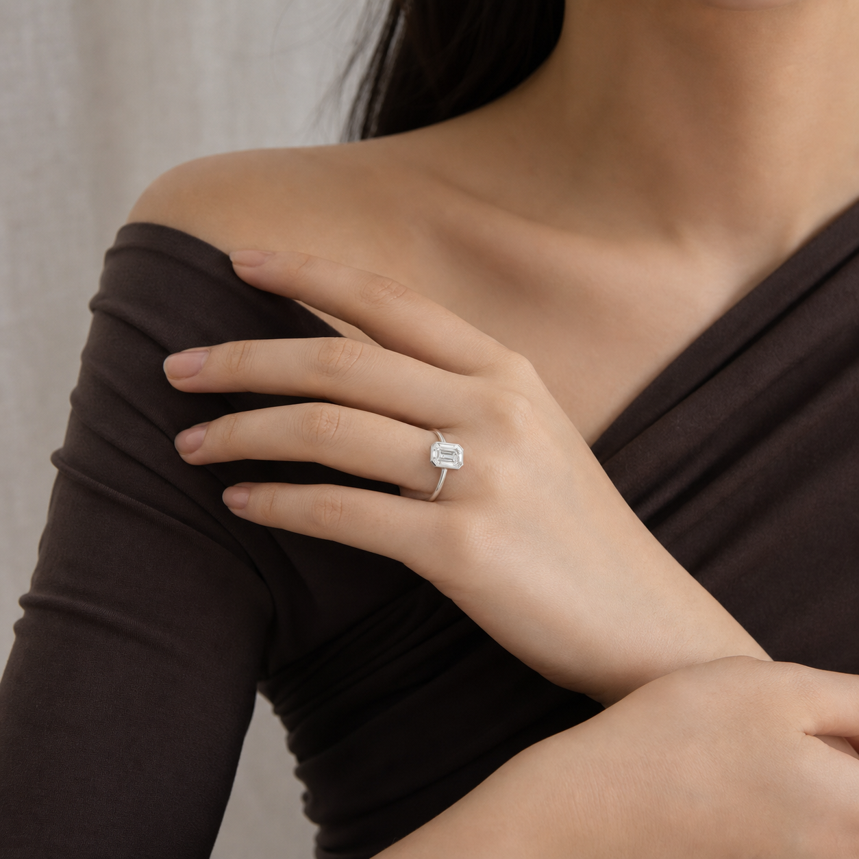 Emerald Slim Tapered Bezel Solitaire in 14K White Gold wearing