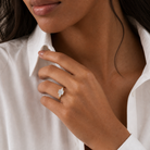 Emerald Pear Side Three Stone Classic in 18K Yellow Gold wearing