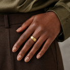 Orla Brushed Beveled Edge Lab-Grown Diamond Wedding Band in 18K Yellow Gold, worn on hand