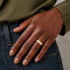 Willa Hammered Concave Comfort Fit Lab-Grown Diamond Wedding Band in 14K Yellow Gold, worn on hand