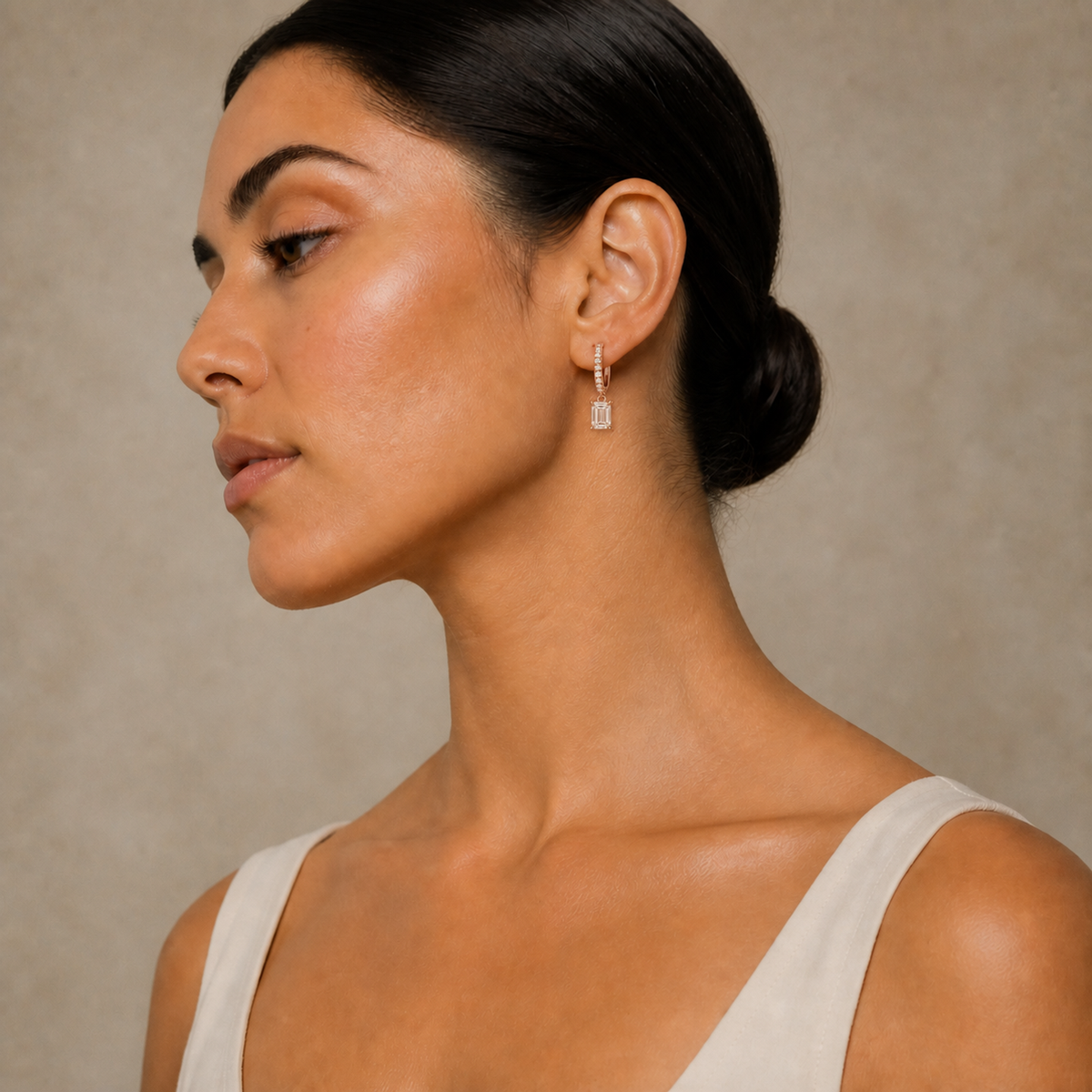 Fiorella Emerald Accented Drop Huggie Hoop Lab-Grown Diamond Earrings in 14K Rose Gold, worn on ear