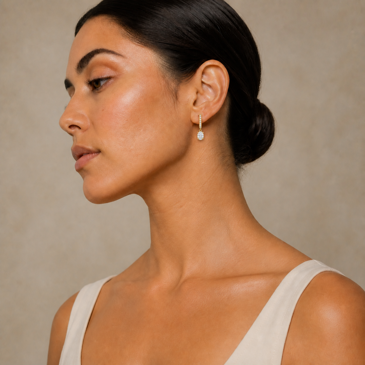 Fiorella Oval Accented Drop Huggie Hoop Lab-Grown Diamond Earrings in 14K Yellow Gold, worn on ear