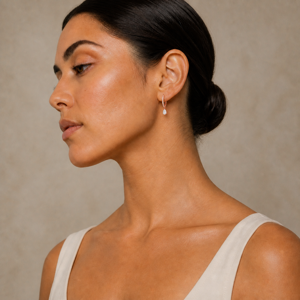 Fiorella Pear Accented Drop Huggie Hoop Lab-Grown Diamond Earrings in 14K Rose Gold, worn on ear