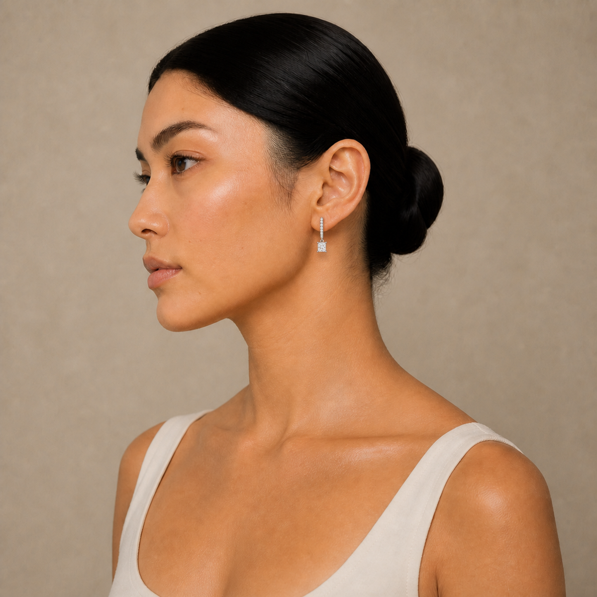 Fiorella Princess Accented Drop Huggie Hoop Lab-Grown Diamond Earrings in 18K White Gold, worn on ear