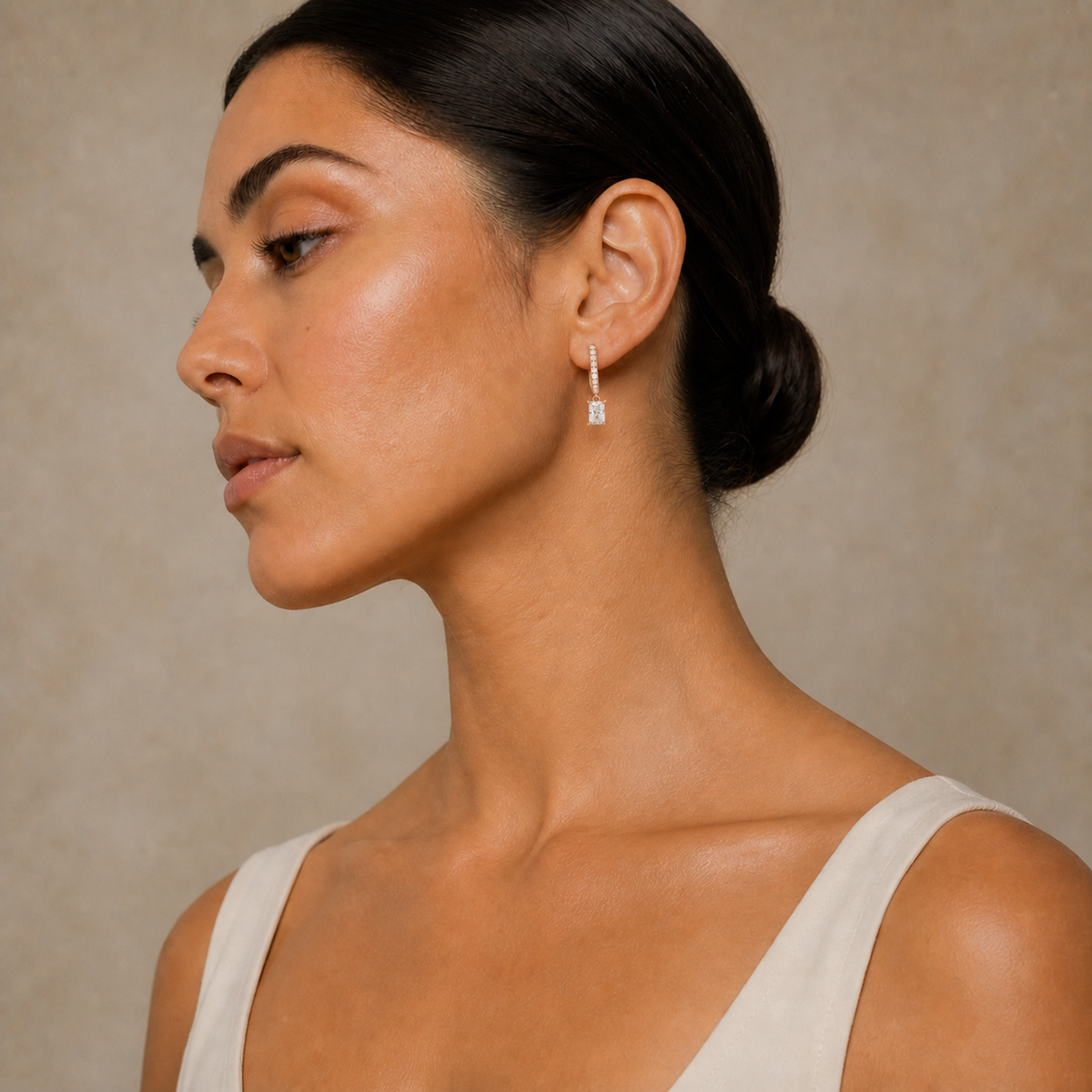Fiorella Radiant Accented Drop Huggie Hoop Lab-Grown Diamond Earrings in 14K Rose Gold, worn on ear