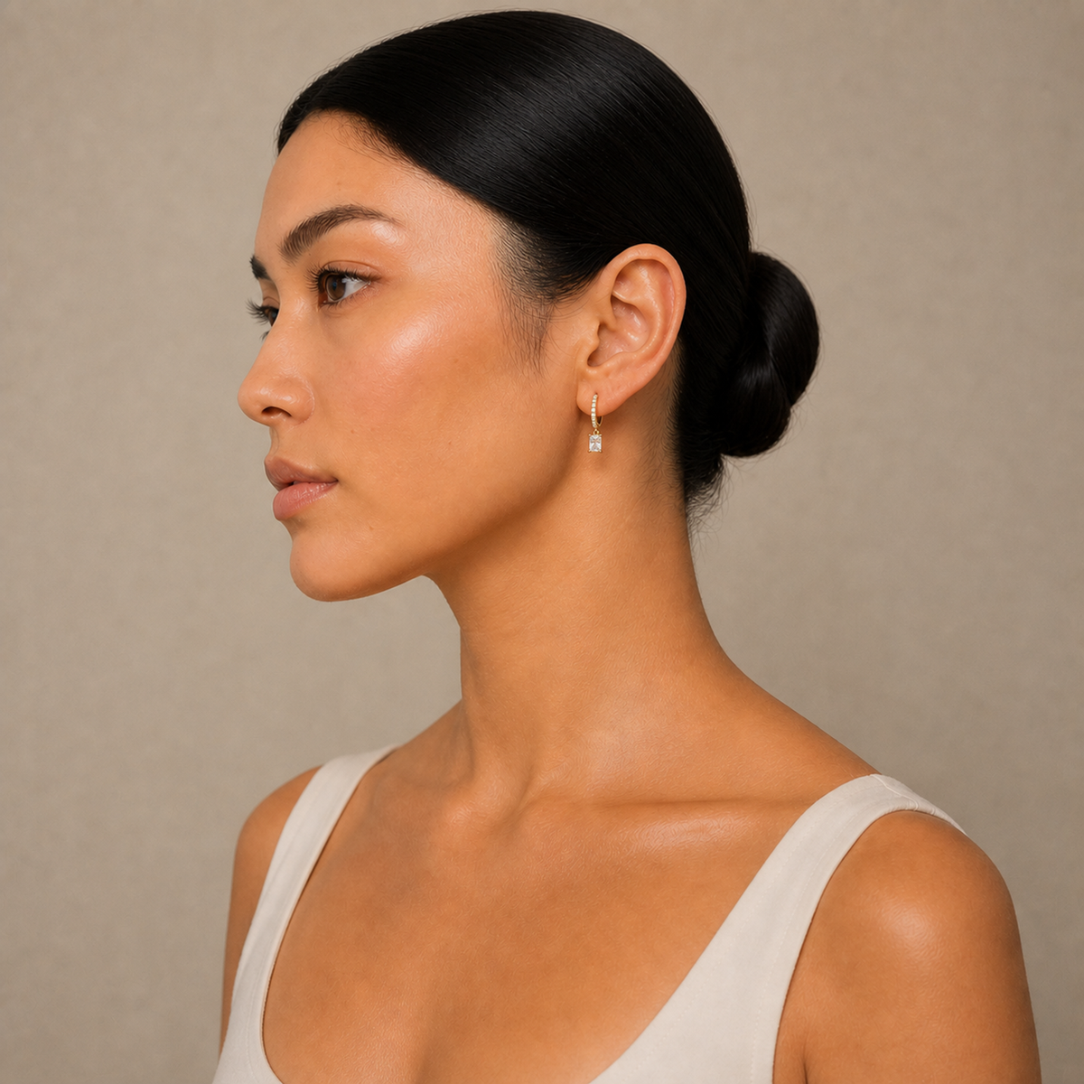 Fiorella Radiant Accented Drop Huggie Hoop Lab-Grown Diamond Earrings in 14K Yellow Gold, worn on ear