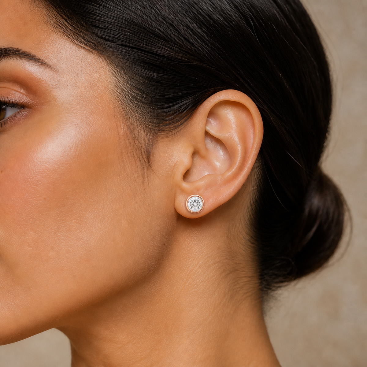 Jolie Round Bezel Solitaire Lab-Grown Diamond Stud Earrings in 14K Rose Gold, worn on ear