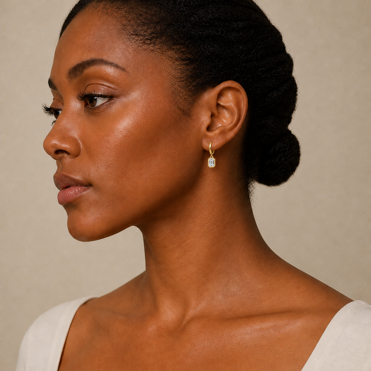 Giselle Emerald Bezel Drop Huggie Hoop Lab-Grown Diamond Earrings in 18K Yellow Gold, worn on ear