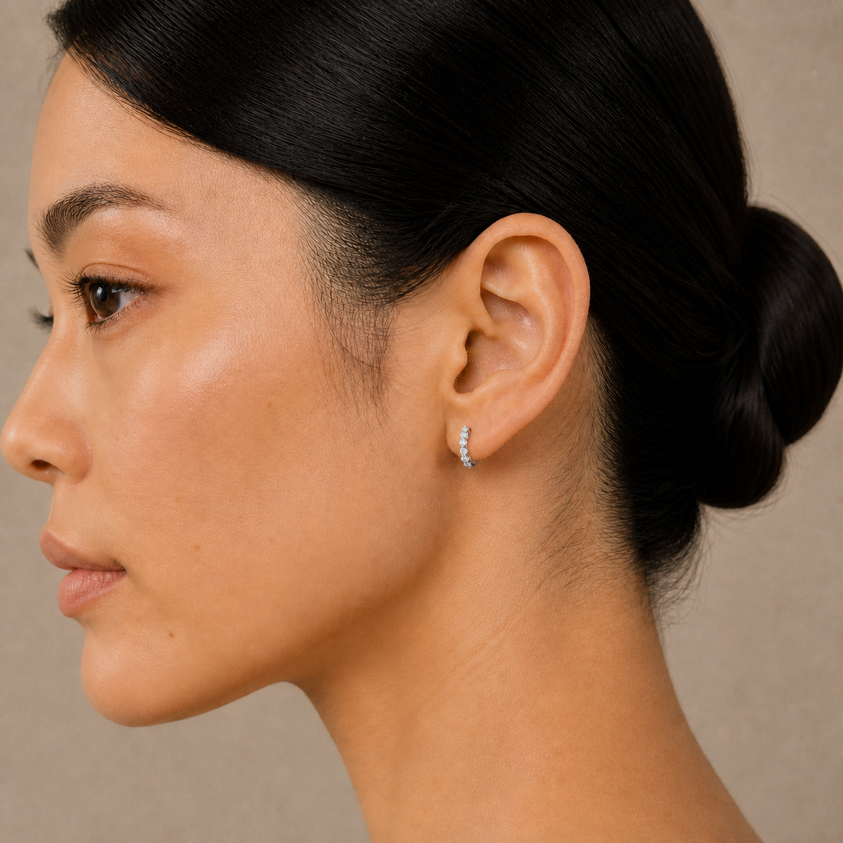 Xanthe Shared Prong Huggie Hoop Lab-Grown Diamond Earrings in 14K White Gold, worn on ear