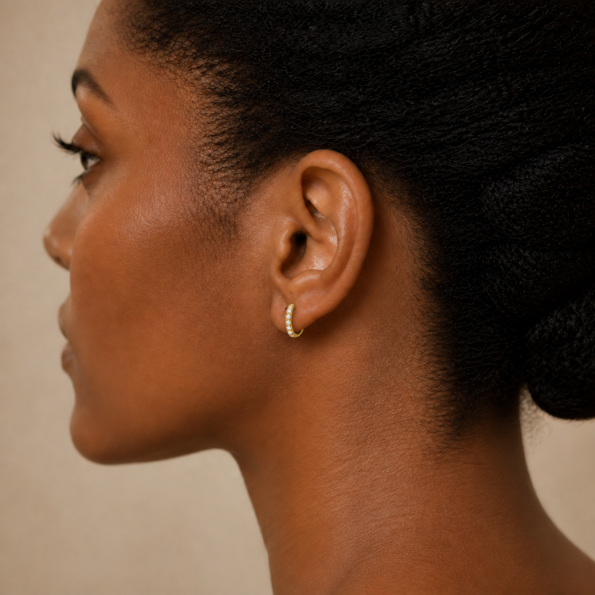 Xanthe Shared Prong Huggie Hoop Lab-Grown Diamond Earrings in 18K Yellow Gold, worn on ear