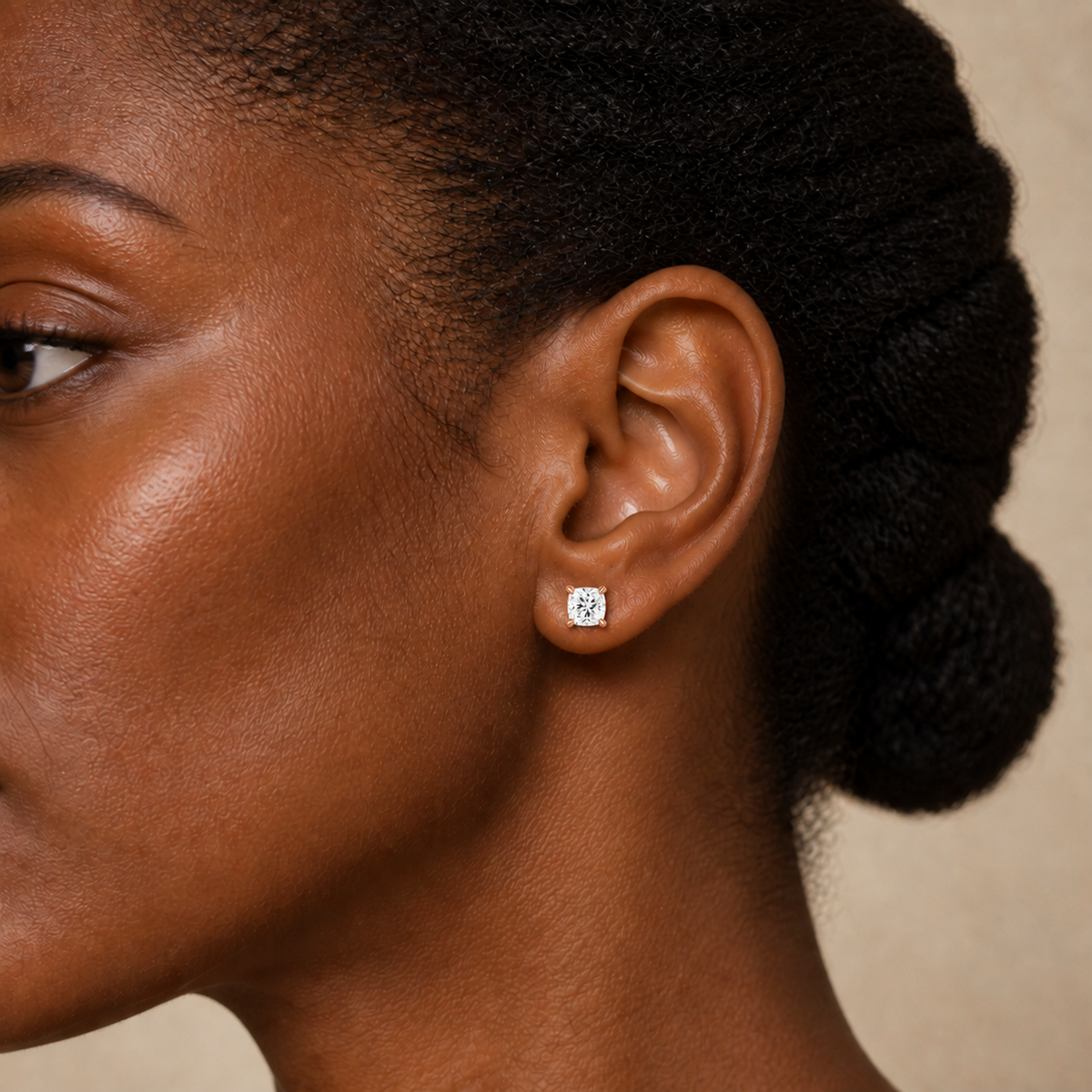 Eira Cushion Solitaire 4-Prong Lab-Grown Diamond Stud Earrings in 14K Rose Gold, worn on ear