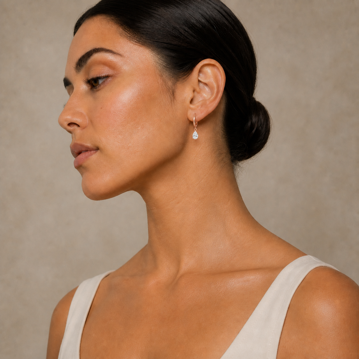 Cerelia Pear Solitaire Drop Huggie Hoop Lab-Grown Diamond Earrings in 14K Rose Gold, worn on ear