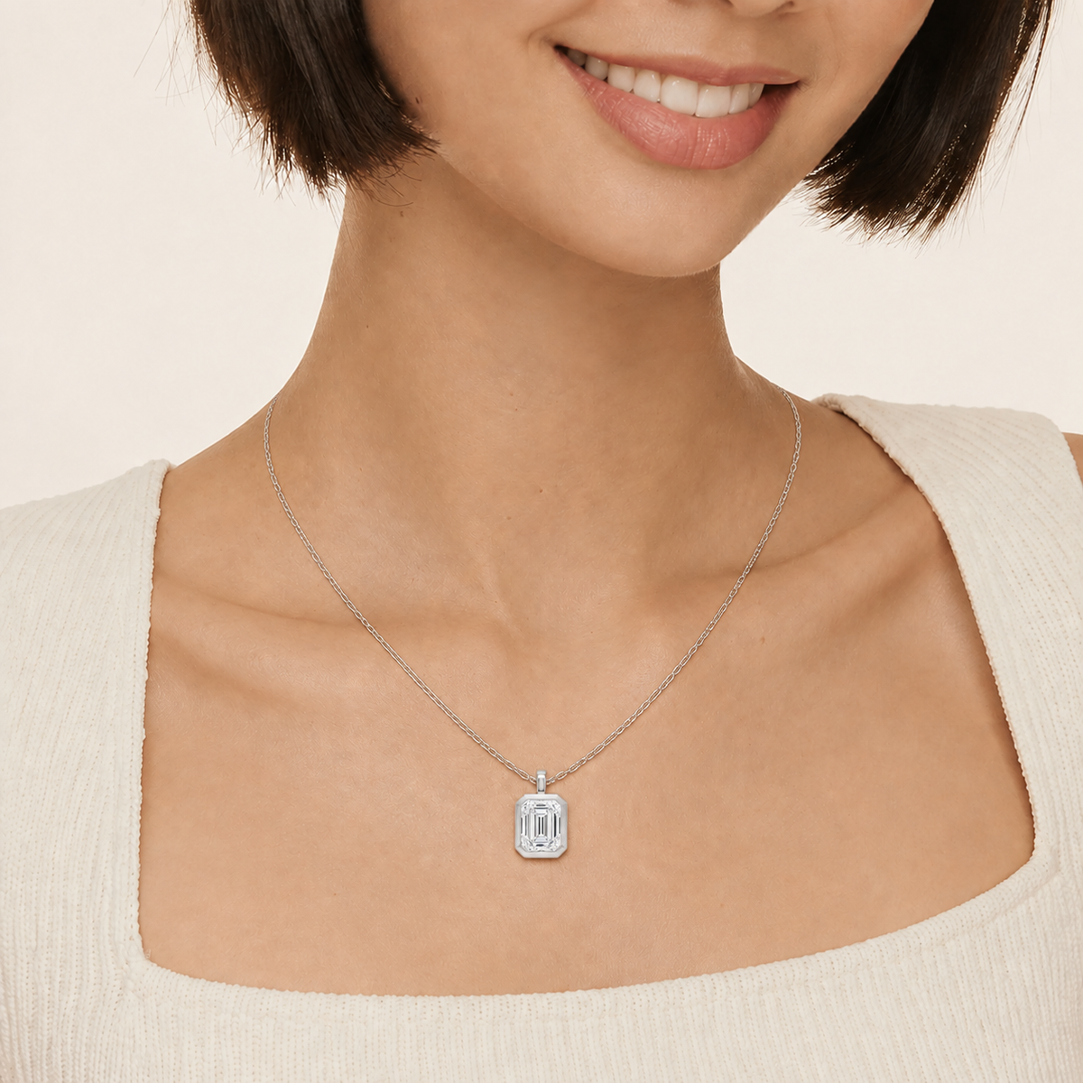 Stellaire Emerald Bezel Solitaire Lab-Grown Diamond Pendant Necklace in 14K White Gold, worn on neck