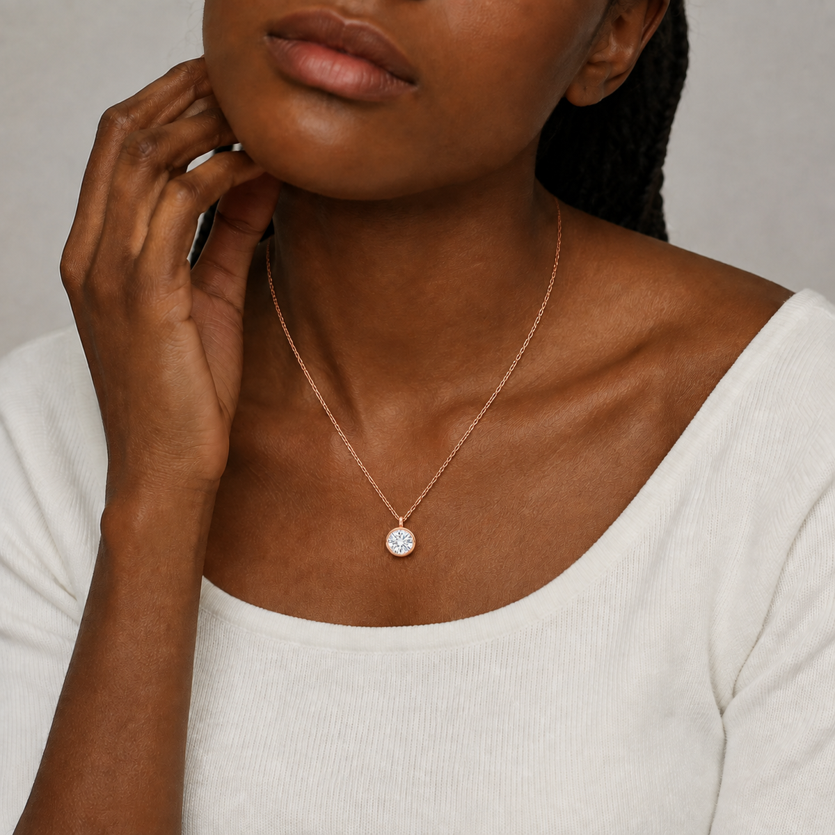 Stellaire Round Bezel Solitaire Lab-Grown Diamond Pendant Necklace in 14K Rose Gold, worn on neck