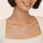 Karina Graduated Single Prong Curved Bar Lab-Grown Diamond Necklace in 14K Yellow Gold, worn on neck
