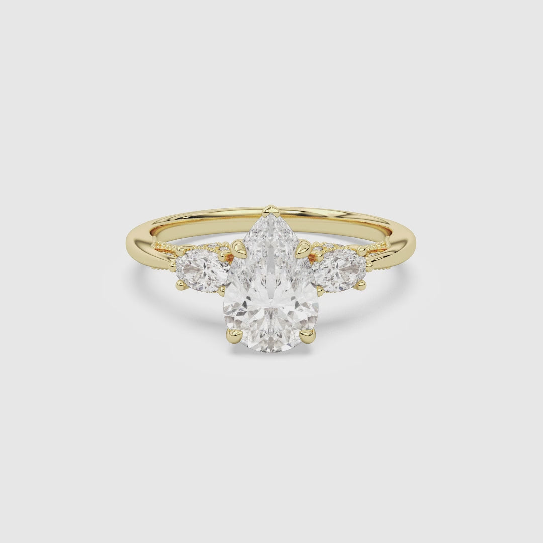 Pear Ornate Accented Three Stone spin video